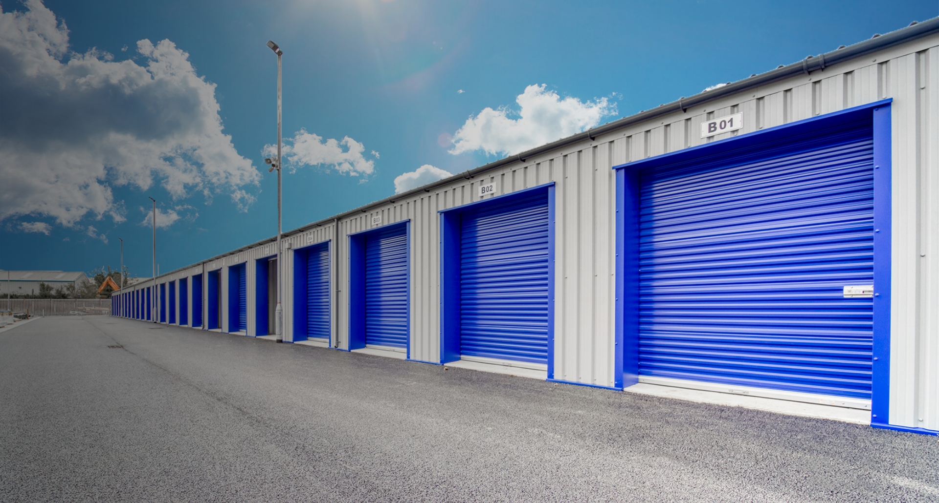 Row of blue-doored drive-up storage units at Bubble Self Storage, Drogheda